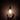 dark room hanging frosted bulb hand reaching for it
