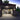 Brightly lit residential garage as seen looking in from the outside at night